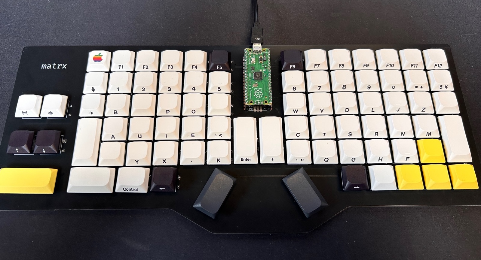 A later handmade Matrx keyboard built on a black circuit board, with a refined key layout and no case.